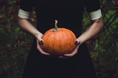 woman holding pumpkin thumbnail