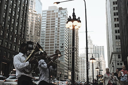 two men playing wind instruments thumbnail