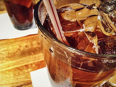 brown liquid filled glass cup with straw thumbnail