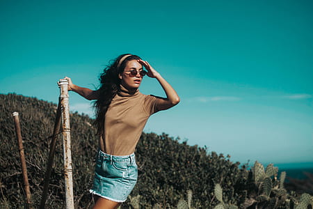 woman holding on brown stick thumbnail