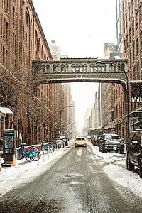gray building overpass photo during snowy day thumbnail