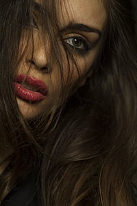 close-up photography of brown and black haired woman thumbnail
