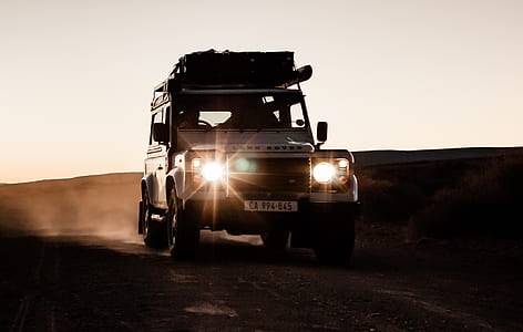 silver Land Rover vehicle on desert thumbnail