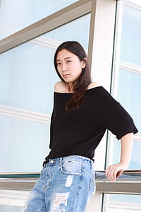 Woman Wearing Black Scoop-neck Shirt thumbnail