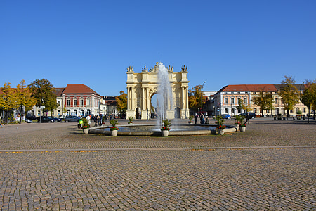 fountain near buildings at daytime thumbnail