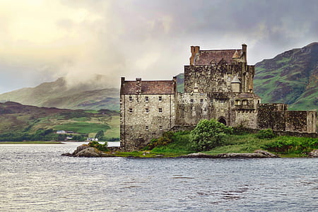 gray concrete castle near body of water thumbnail