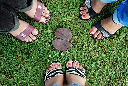 person wearing pair of black-and-brown sandals thumbnail