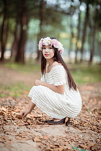 shallow focus photography of woman in white off-shoulder dress thumbnail