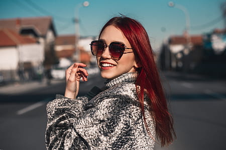 woman standing on asphalt road thumbnail