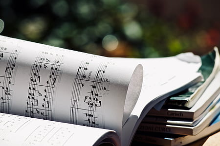 selective focus photography of music notes printed book thumbnail