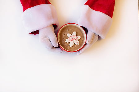 person holding red ceramic mug with coffee thumbnail