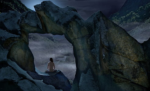 woman sitting on rock formation thumbnail