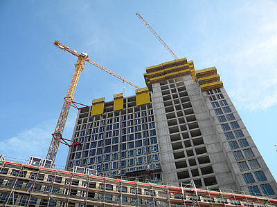 worm's-eye view photo of gray concrete building during daytime thumbnail