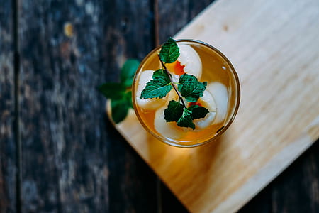 clear glass cup on beige wooden board thumbnail