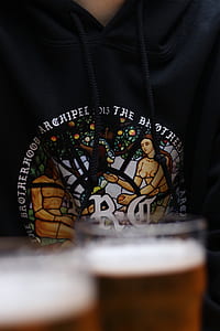 person wearing black and white printed hoodie thumbnail
