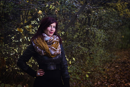woman standing beside tree thumbnail