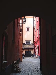 white and red concrete building view from inside hallway thumbnail