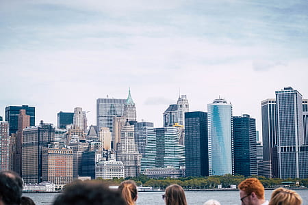 group of people in front of high rise building thumbnail