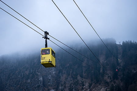 yellow and black cable cart at daytime thumbnail