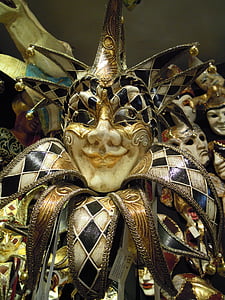 beige, black, and white mask thumbnail