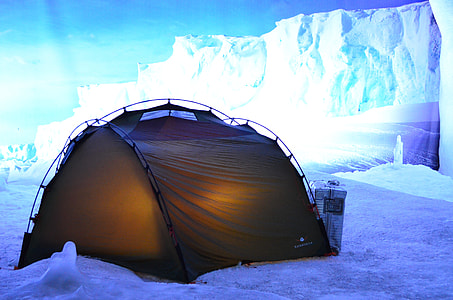 lighted dome tent beside snow mountain during daytime thumbnail
