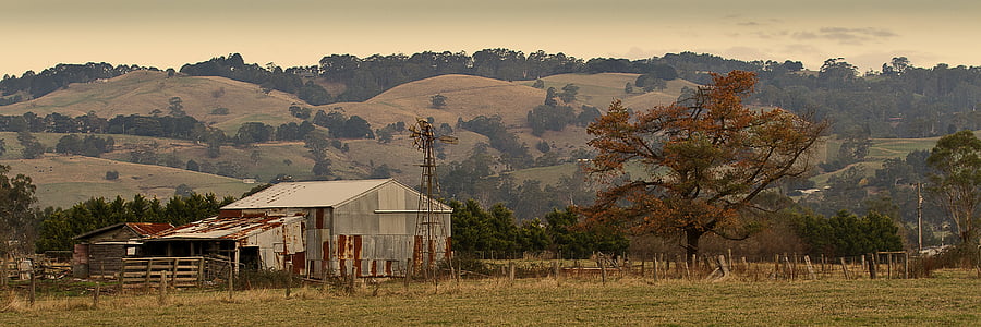 white barn on the foot of the mountain at daytime thumbnail