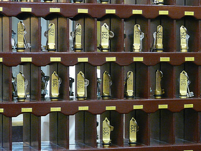 gold components on brown cubby shelf thumbnail