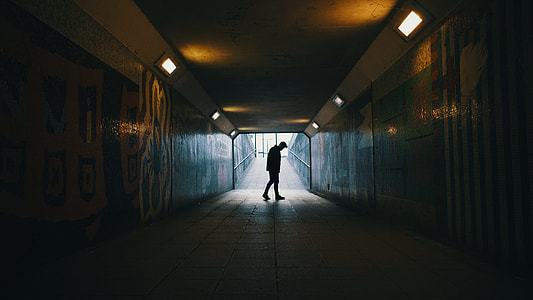 man walking in tunnel thumbnail