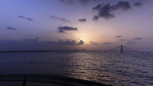 body of water under cloudy sky thumbnail