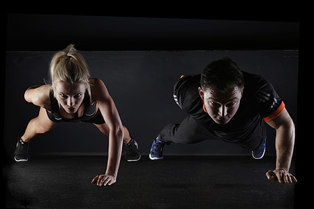 Fitness couple doing working out exercises in the gym thumbnail