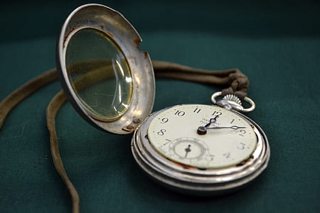 silver-colored pocket watch thumbnail