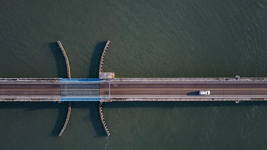 aerial photo of car moving toward on bridge thumbnail
