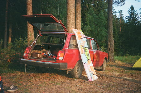 Opened Rear Door of Red 3-door Hatchback Parked Near Trees thumbnail