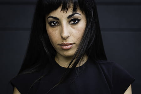 woman wearing black cap-sleeved top thumbnail