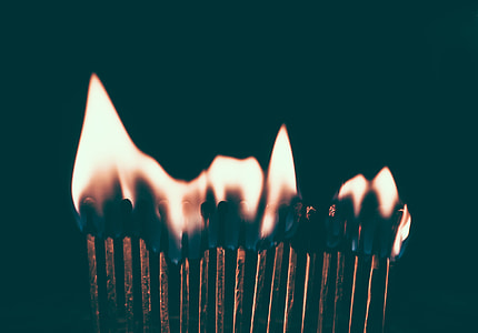 lined up lighted matchsticks thumbnail