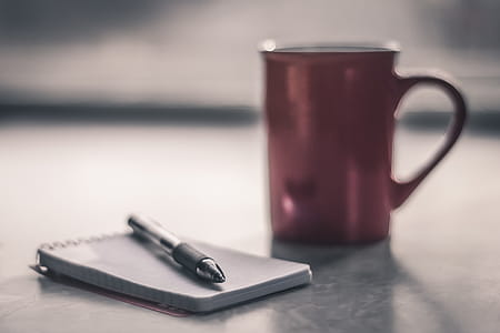 Focus Photography of Black Ballpoint Pen on Ticker thumbnail