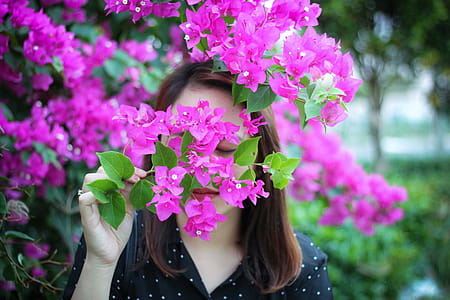 Photo of Woman Smelling Purple Flowers thumbnail