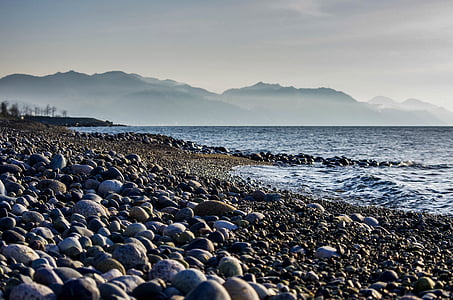 stones near seashore at daytime thumbnail