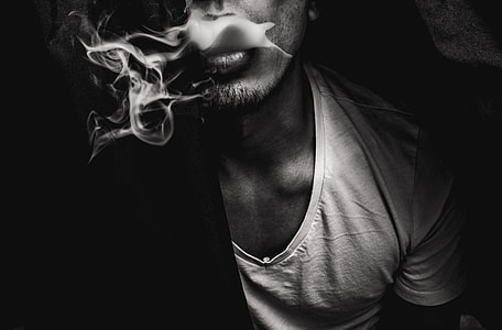 man in scoop neck shirt smoking thumbnail