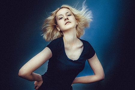 woman wearing black scoop-neck shirt making pose thumbnail