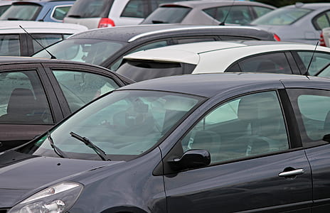 assorted-color vehicle parked alongside other vehicles at daytime thumbnail