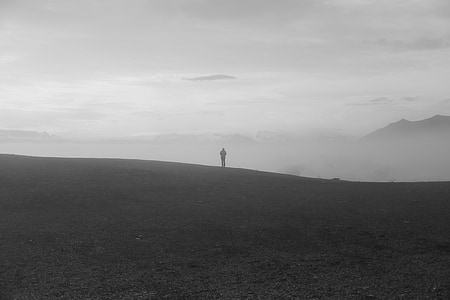person standing on gray field thumbnail