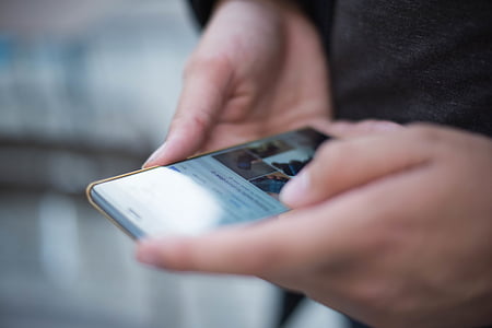 person using black smartphone thumbnail