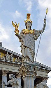 person holding person with angel and spear statue thumbnail