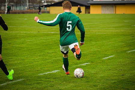 man playing soccer on field thumbnail