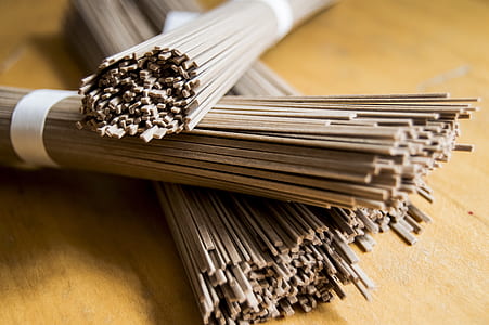 bundle of incense sticks on brown surface thumbnail
