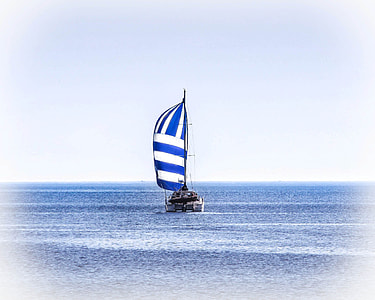 white yacht on body of water under white sky thumbnail