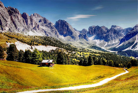 house near trees under mountains at daytime thumbnail