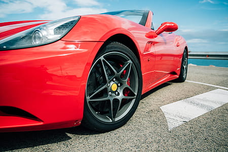 Red Sports Car Wheel Close Up Photo thumbnail