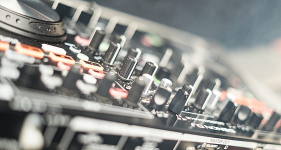 shallow focus photography of DJ turn table controller thumbnail